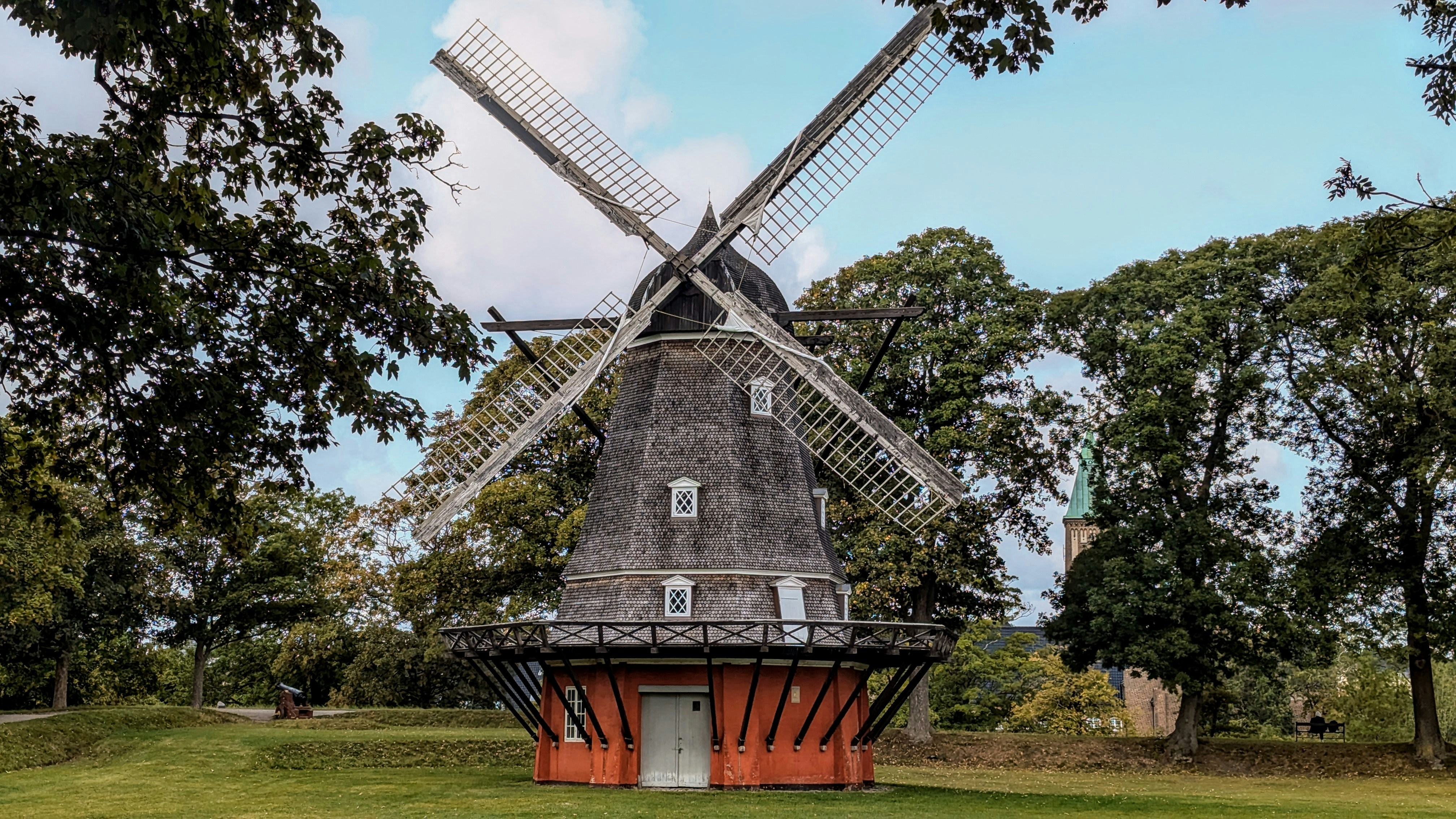 Elegant townhouses in Frederiksberg with a windmill and green spaces